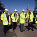 Dan Haslar, senior property manager at PD Ports, (orange hat), congratulates UK Docks founder Harry Wilson and his sons Gary, Jonathan and Chris.