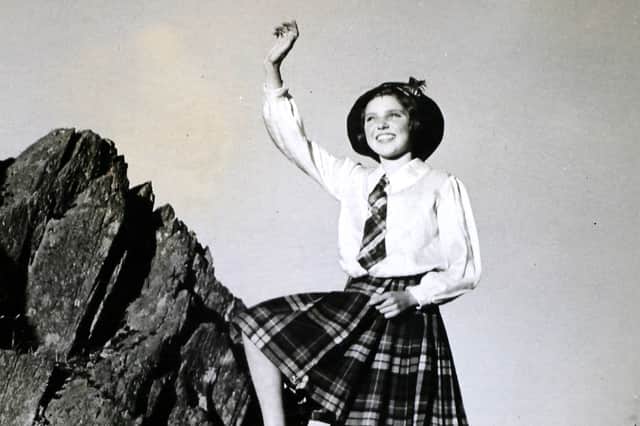 This little girl is ' on top of the world '. She is a South Shields evacuee who climbed high at Rydal to see the grandeur of the Lake District. 
(Photo by Hulton Archive/Getty Images)