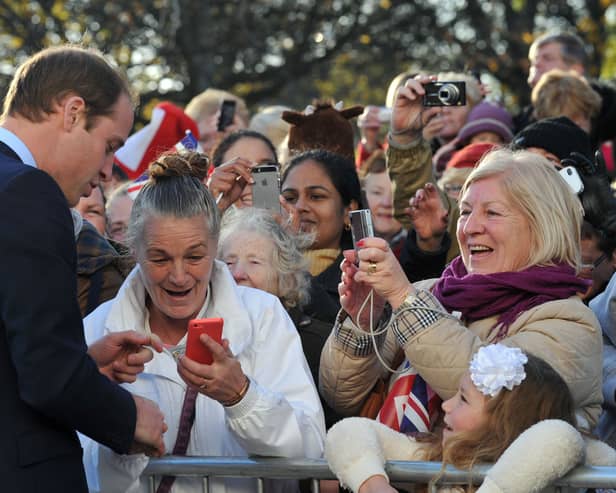 Prince William, Duke of Cambridge speaks to people gathered outside at the Haven Point leisure centre. (Photo by Neil Jones - WPA Pool /Getty Images)