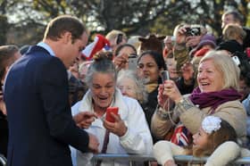 Prince William, Duke of Cambridge speaks to people gathered outside at the Haven Point leisure centre. (Photo by Neil Jones - WPA Pool /Getty Images)