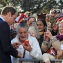 Prince William, Duke of Cambridge speaks to people gathered outside at the Haven Point leisure centre. (Photo by Neil Jones - WPA Pool /Getty Images)