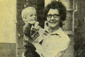Jean Cameron and her son who were preparing themselves for a trek to their toilet in 1971.