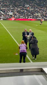 Darren Eales and Bob Moncur with Carabao Cup trophy at St James' Park