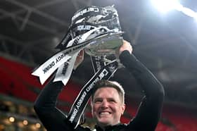 Eddie Howe, manager of Newcastle United, lifts the Carabao Cup Trophy.
