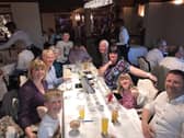 A whole table of happy faces in this lovely view from eight years ago.