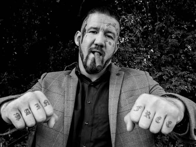Bare knuckle fighter poses for photograph