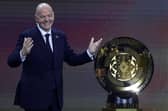 FIFA President Gianni Infantino presents The FIFA Club World Cup Trophy during the 2025 FIFA Club World Cup Draw at Telemundo Studios on December 05, 2024 in Miami, Florida.  (Photo by Brennan Asplen/Getty Images)