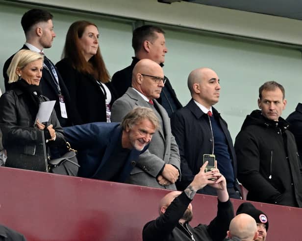 Sir Jim Ratcliffe, owner of Manchester United poses for a photo as Dan Ashworth, Sporting director of Manchester United looks on.