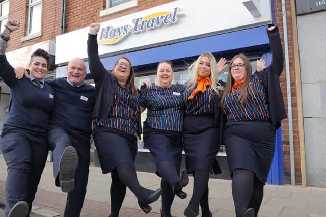 Hays Travel staff celebrate their bumper bonus payments.