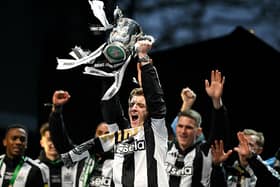 Anthony Gordon lifting the Carabao Cup. 
