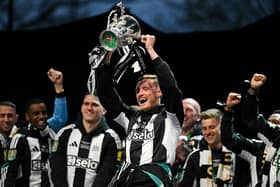 Sean Longstaff lifting the Carabao Cup for Newcastle United. 