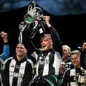 Sean Longstaff lifting the Carabao Cup for Newcastle United. 