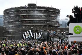 Newcastle United's players celebrate on an open-top bus with the League Cup trophy as they parade through the city of Newcastle upon Tyne in north-east England on March 29, 2025, after winning the English League Cup, their first domestic trophy for 70 years. (Photo by Oli SCARFF / AFP) (Photo by OLI SCARFF/AFP via Getty Images)          