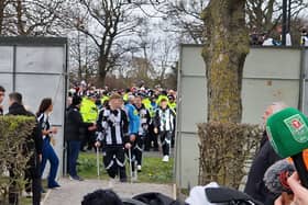 Newcastle United defender Lewis Hall on crutches. 