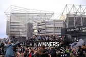 Joelinton, Kieran Trippier, Bruno Guimaraes, Harvey Barnes, Mark Gillespie, Dan Burn, celebrate with the Carabao Cup Trophy as Eddie Howe, Manager of Newcastle United, Anthony Gordon look on during the Newcastle United trophy parade and celebration on March 29, 2025 in Newcastle upon Tyne, England. Newcastle United defeated Liverpool in the Carabao Cup Final to end their seventy-year domestic trophy drought. (Photo by Stu Forster/Getty Images)
