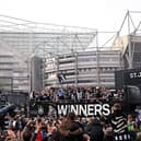 Joelinton, Kieran Trippier, Bruno Guimaraes, Harvey Barnes, Mark Gillespie, Dan Burn, celebrate with the Carabao Cup Trophy as Eddie Howe, Manager of Newcastle United, Anthony Gordon look on during the Newcastle United trophy parade and celebration. (Photo by Stu Forster/Getty Images)