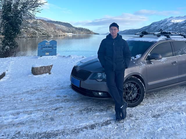 Yukun with his trusty Chinese car.