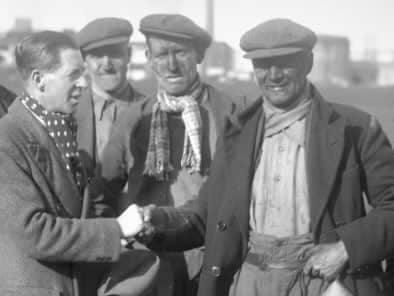 Harry gets a handshake in 1936 as he gets the news that he is going to referee the FA Cup Final.