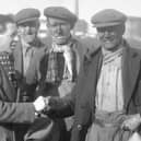 Harry gets a handshake in 1936 as he gets the news that he is going to referee the FA Cup Final.