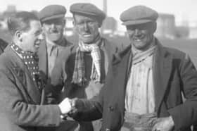Harry gets a handshake in 1936 as he gets the news that he is going to referee the FA Cup Final.
