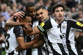 Alexander Isak of Newcastle celebrates with team mates Jacob Murphy (l) Bruno Guimaraes and Sandro Tonali (r) after scoring the first Newcastle goal during the Premier League match between Newcastle United FC and Brentford FC at St James' Park on April 02, 2025 in Newcastle upon Tyne, England. (Photo by Stu Forster/Getty Images)