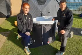 Kimberley Kerry and John Miller next to one of their pop-up plunge pools and their pop-up sauna.