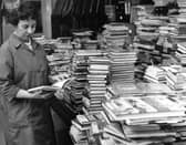 Miss Elsie Ord, schools librarian, looks at some of the new books in the South Tyneside stock in 1968.