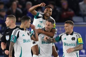 Newcastle United's Jacob Murphy celebrates on the back of Newcastle United's Swiss defender Fabian Schar, who's long-range shot came back off the woodwork to enable Murphy to score during the English Premier League football match between Leicester City and Newcastle United at King Power Stadium in Leicester.