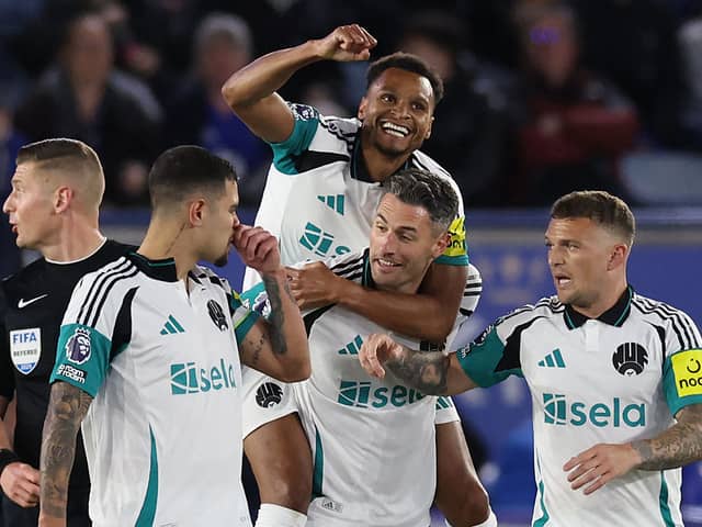 Newcastle United's Jacob Murphy celebrates on the back of Newcastle United's Swiss defender Fabian Schar, who's long-range shot came back off the woodwork to enable Murphy to score during the English Premier League football match between Leicester City and Newcastle United at King Power Stadium in Leicester.