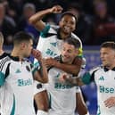 Newcastle United's Jacob Murphy celebrates on the back of Newcastle United's Swiss defender Fabian Schar, who's long-range shot came back off the woodwork to enable Murphy to score during the English Premier League football match between Leicester City and Newcastle United at King Power Stadium in Leicester.