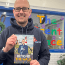 Pets2impress owner Tim Jackson holding his sixth book.
