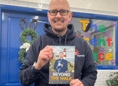 Pets2impress owner Tim Jackson holding his sixth book.