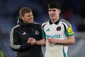 Newcastle United's English head coach Eddie Howe (L) celebrates with Newcastle United's English defender #21 Valentino Livramento (R) on the pitch after the English Premier League football match between Leicester City and Newcastle United at King Power Stadium in Leicester.