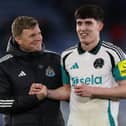 Newcastle United's English head coach Eddie Howe (L) celebrates with Newcastle United's English defender #21 Valentino Livramento (R) on the pitch after the English Premier League football match between Leicester City and Newcastle United at King Power Stadium in Leicester.