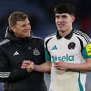 Newcastle United's English head coach Eddie Howe (L) celebrates with Newcastle United's English defender #21 Valentino Livramento (R) on the pitch after the English Premier League football match between Leicester City and Newcastle United at King Power Stadium in Leicester.