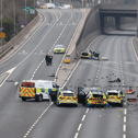 Two people have been arrested after seven police officers required hospital treatment following a collision on the A1.