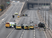 Two people have been arrested after seven police officers required hospital treatment following a collision on the A1.