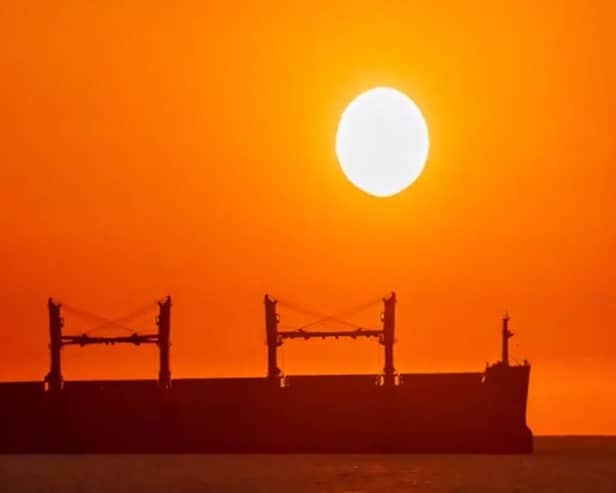 Striking sunrise over ship on the Port of Tyne.