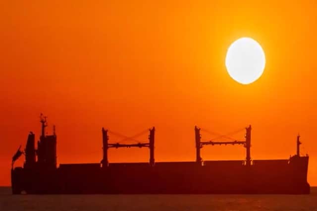 Striking sunrise over ship on the Port of Tyne.