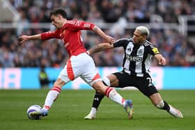 Joelinton of Newcastle United challenge Manuel Ugarte of Manchester United during the Premier League match between Newcastle United FC and Manchester United FC at St James' Park on April 13, 2025 in Newcastle upon Tyne, England. (Photo by Stu Forster/Getty Images)