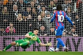 Newcastle United's English goalkeeper #22 Nick Pope stops the penalty kick of Crystal Palace's English midfielder #10 Eberechi Eze during the English Premier League football match between Newcastle United and Crystal Palace at St James' Park in Newcastle-upon-Tyne, north east England on April 16, 2025. (Photo by ANDY BUCHANAN / AFP) 