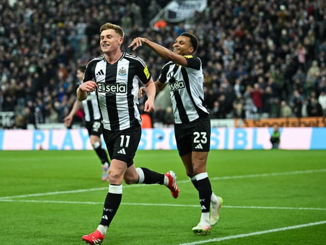 Newcastle United's Harvey Barnes celebrates with teammates.