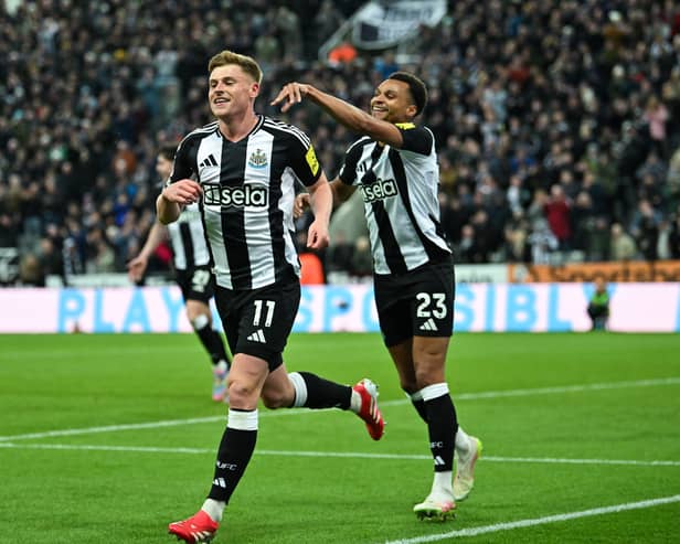 Newcastle United's Harvey Barnes celebrates with teammates.