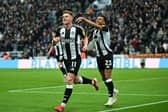 Newcastle United's Harvey Barnes celebrates with teammates.