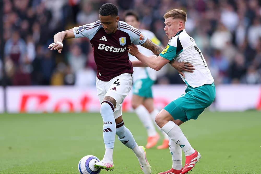 Ezri Konsa and Harvey Barnes in action as Newcastle United play Aston Villa at Villa Park. 