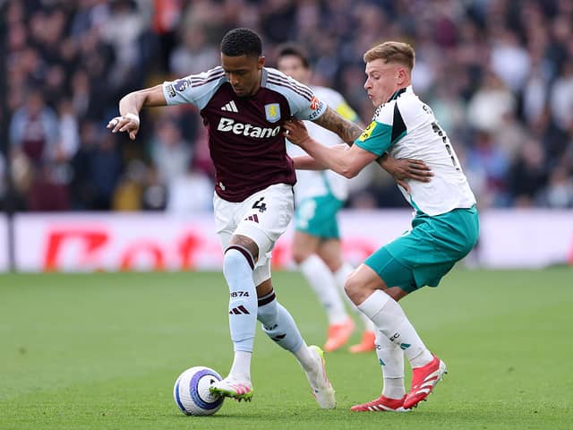 Ezri Konsa and Harvey Barnes in action as Newcastle United play Aston Villa at Villa Park. 
