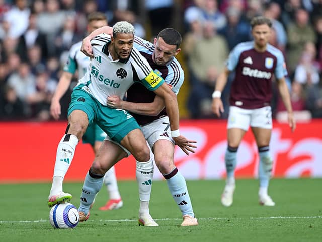 Joelinton of Newcastle United battles for possession with John McGinn of Aston Villa during the Premier League match between Aston Villa FC and Newcastle United FC at Villa Park on April 19, 2025 in Birmingham, England. (Photo by Shaun Botterill/Getty Images)