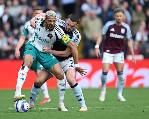 Joelinton of Newcastle United battles for possession with John McGinn of Aston Villa during the Premier League match between Aston Villa FC and Newcastle United FC at Villa Park on April 19, 2025 in Birmingham, England. (Photo by Shaun Botterill/Getty Images)