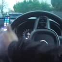 Disqualified driver jumps from moving car during police chase.