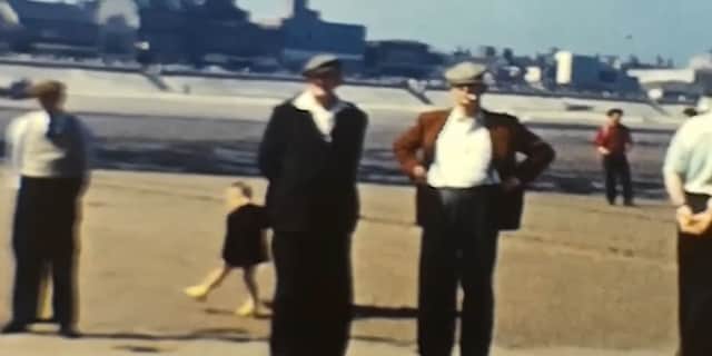 People watch a lifeboat launching in 1950s Redcar.